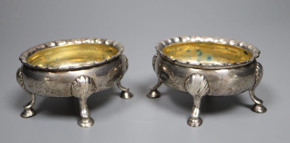 Two similar mid 18th century silver oval salts, London, 1753? and 1762, marks rubbed, length 8.5cm, 6oz.